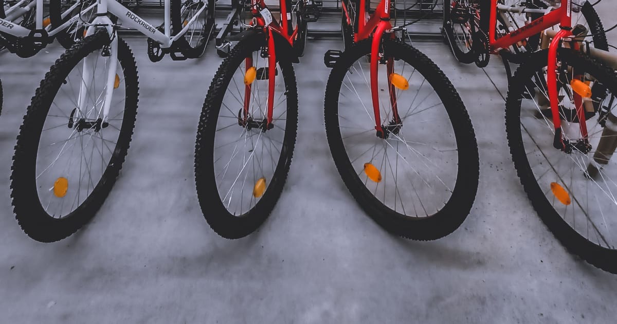 Rows of new bicycles on a shop floor